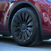 Set van vier tesla model y wieldoppen 19 inch Blades zwart, geschikt voor de 19 inch Gemini velgen, netjes uitgelijnd op een witte ondergrond.