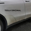 Inhoud van de tesla model y ppf diy kit netjes uitgestald met folie, handleiding, reinigingsspray en montagegereedschap.
